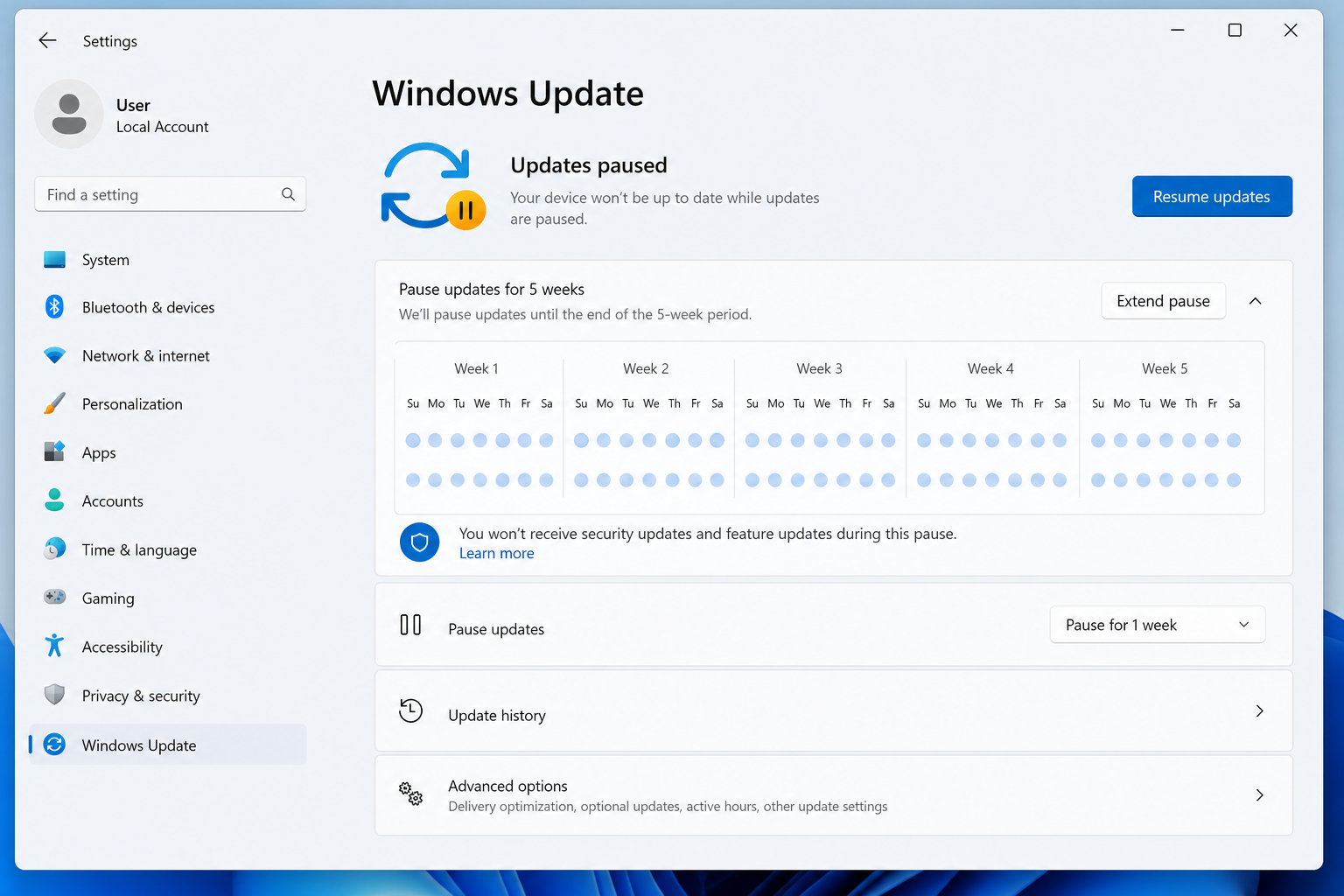 Windows 11 Settings screen pausing updates to prevent BitLocker boot issues